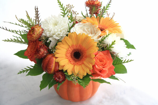 orange and white flowers, pumpkin vase tablecentre