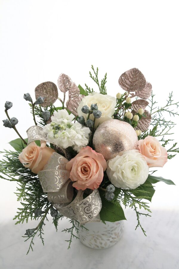 peach roses, champagne sparkle accents, winter greenery, blush bobbles, white flowers, in white glass leaf vase