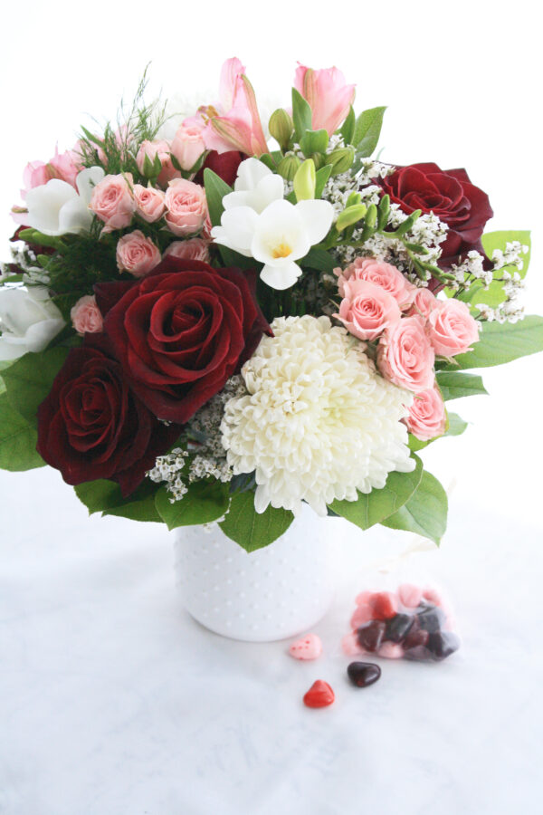 pink, burgundy, red and white flowers for Valentin's day in white vase